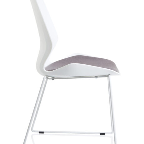 Florence Sled Chair with white frame and gray fabric seat, designed for modern guest seating in compact spaces.