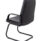 Canasta Visitor Chair in black faux leather with fixed arms and a steel cantilever base, featuring stylish stitching.