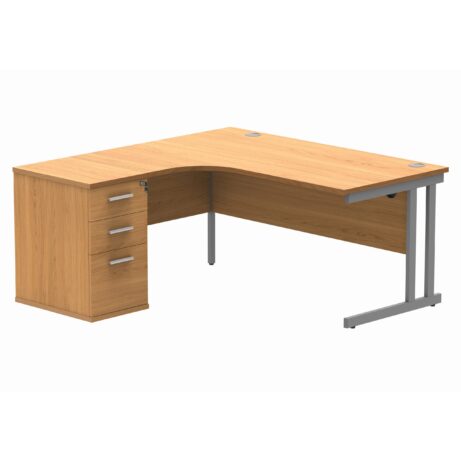 Double upright left-hand radial desk in Norwegian Beech with a silver desk high pedestal, 1600x1200mm top, 600mm deep.