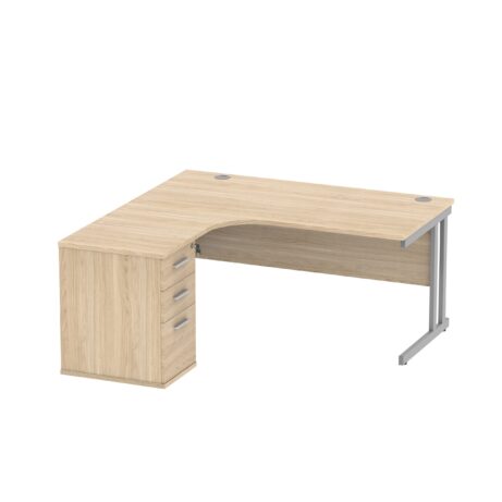 Double upright left hand radial desk with desk high pedestal, Canadian Oak finish, 1600 x 1200mm dimensions, silver accents.