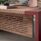E10 Executive Desk & Return with veneered top, leather inlays, and carved modesty panel, showcasing a bold, L-shaped design.