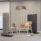 Flexible Hive Screens with six panels, featuring grey and black finishes, supported by a robust MFC base in an office setting.