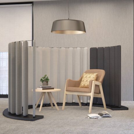 Flexible Hive Screens with six panels, featuring grey and black finishes, supported by a robust MFC base in an office setting.