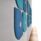 Hush Wall Mounted Acoustic Panels, 590mm, timber center, reversible two-tone fabric, arranged in blue-green colors.