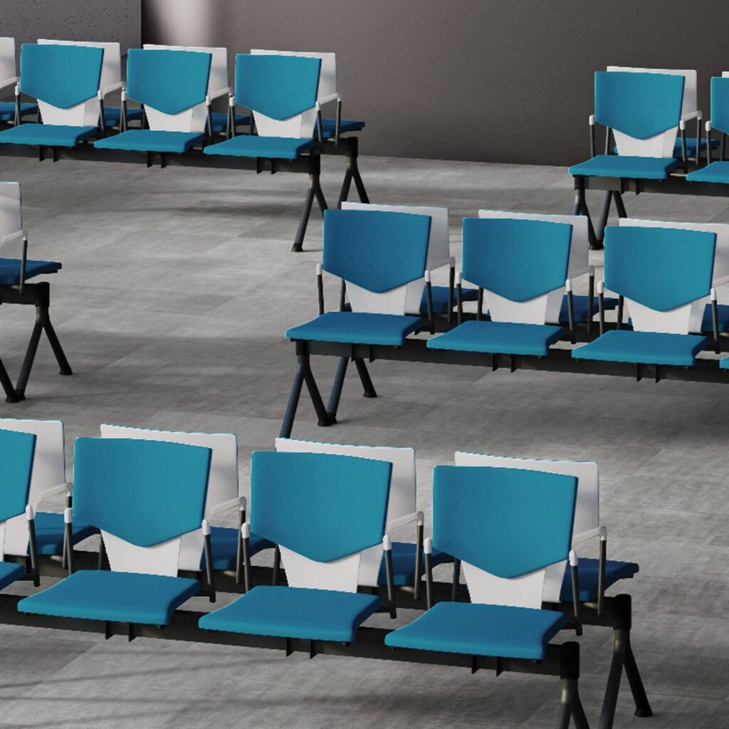 IKON Beam seating in blue faux leather, modular design, flexible 2–5 seats, on a black steel frame for reception areas.