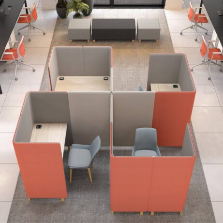 Modular Oasis Screens in orange and gray create private work zones with desks in an open-plan office space.