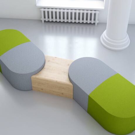 Modular PILL seating in green and gray with integrated wooden table for flexible breakout or reception spaces.