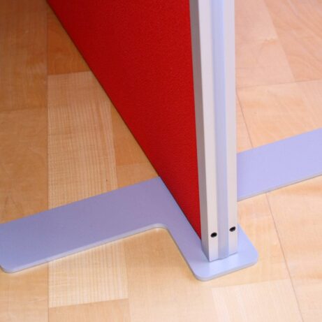 Floor Standing System Screen with a red fabric finish and a gray metal base, designed for privacy in open-plan offices.
