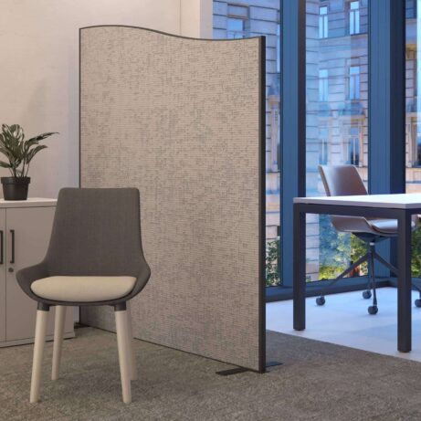 Freestanding curved Floor Standing System Screen in a modern office setting, providing privacy and noise control.