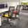 Touch Mesh Task Chairs in yellow and red with mesh backrests, positioned at office workstations in a modern workspace.