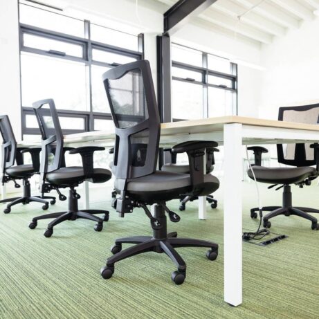 Touch Mesh Task Chair with a breathable mesh backrest and contoured seat, set in a modern office environment.