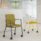 Infinity Meeting Chair in white with a 4-legged frame on castors, alongside a green and black variant. Ideal for flexible spaces.