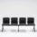 Modular SHILA Beam seating in black, designed for waiting rooms and reception areas, featuring four seats without armrests.