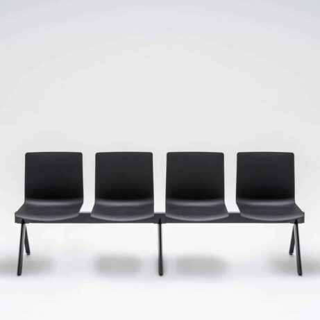 Modular SHILA Beam seating in black, designed for waiting rooms and reception areas, featuring four seats without armrests.