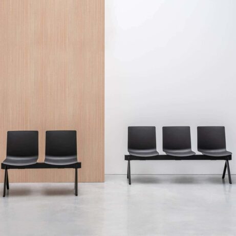 SHILA Beam seating in black, featuring a modular design with two and four-seat benches, suitable for reception areas.